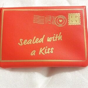 IPSy cosmetic red bag